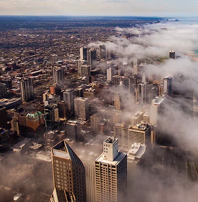 Aerial view Chicago's skyline, partially covered by clouds