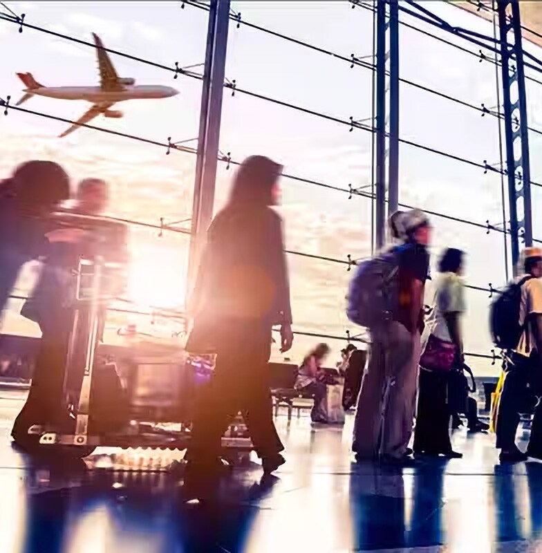 Motion-blur shot of people walking in an airport lobby