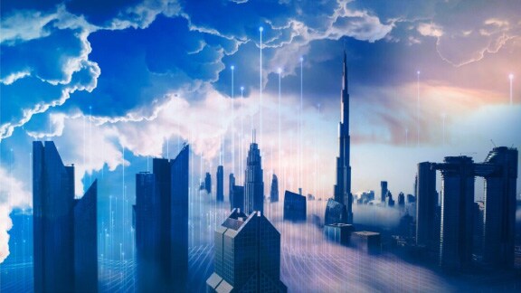 Tops of buildings in downtown Dubai shrouded in fog